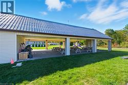 Surrounding community with a patio and a lawn - 