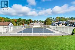 View of pool with a residential view and view of wooded area - 
