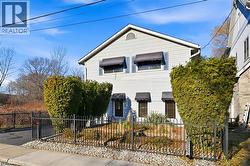 Traditional-style house featuring a fenced front yard - 