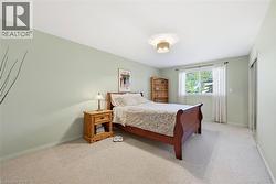 Bedroom featuring carpet floors and baseboards - 