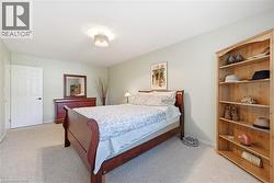 Bedroom with light colored carpet - 