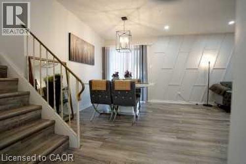 Dining area with wood finished floors, stairway, and recessed lighting - 147 Muriel Crescent, London, ON - Indoor Photo Showing Other Room
