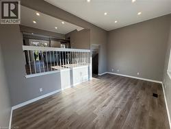 Unfurnished room featuring recessed lighting and wood finished floors - 