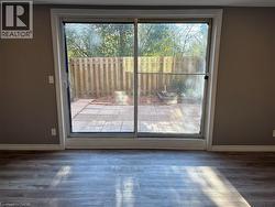 Entryway with wood finished floors and baseboards - 