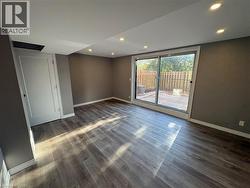 Unfurnished room with recessed lighting and wood finished floors - 