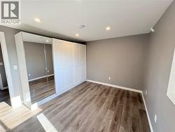 Unfurnished bedroom with recessed lighting, a closet, and light wood-type flooring - 