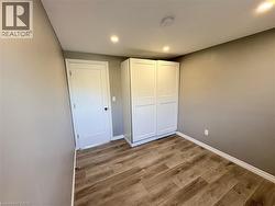 Unfurnished bedroom featuring light wood-style floors and recessed lighting - 
