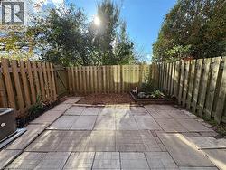 Fenced backyard with a patio area - 