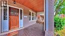 Doorway to property featuring a porch and brick siding - 25 Spadina Avenue, Hamilton, ON  - Outdoor With Deck Patio Veranda With Exterior 