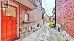 View of side of property featuring brick siding - 