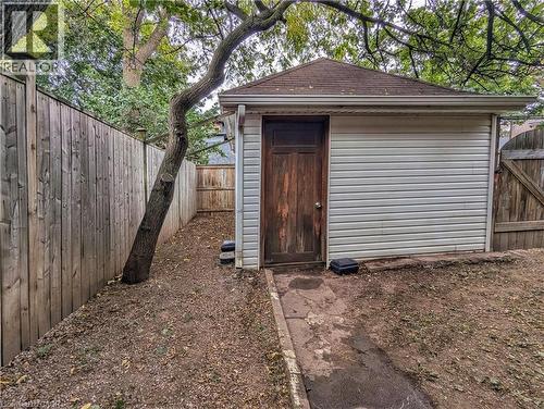 View of shed with a fenced backyard and a gate - 25 Spadina Avenue, Hamilton, ON - Outdoor With Exterior
