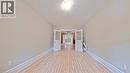 Hallway with baseboards and light wood-style floors - 25 Spadina Avenue, Hamilton, ON  - Indoor Photo Showing Other Room 