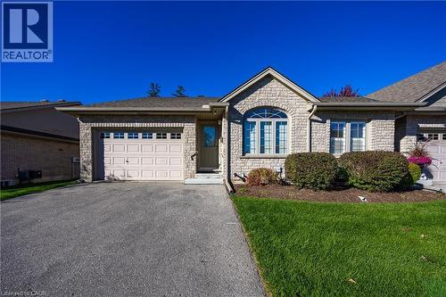 End unit. Room for 2 cars in driveway. - 510 Queensway W Unit# 5, Simcoe, ON - Outdoor With Facade