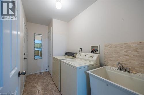 Main floor laundry area and a utility closet/pantry. - 510 Queensway W Unit# 5, Simcoe, ON - Indoor Photo Showing Laundry Room