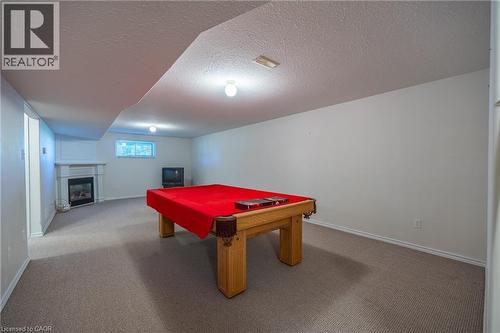 Huge carpeted rec room with gas fireplace. - 510 Queensway W Unit# 5, Simcoe, ON - Indoor Photo Showing Other Room