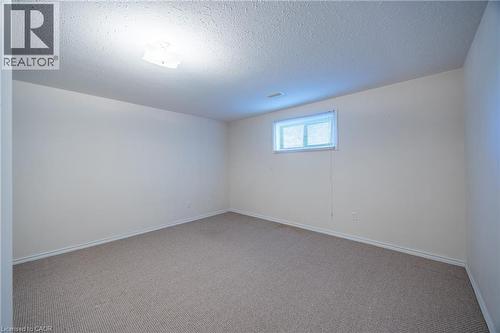 Lower level carpeted bedroom. - 510 Queensway W Unit# 5, Simcoe, ON - Indoor Photo Showing Other Room