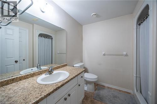 Lower level 3 pc. bathroom complete with stand up shower unit and ceramic floors and linen closet. - 510 Queensway W Unit# 5, Simcoe, ON - Indoor Photo Showing Bathroom