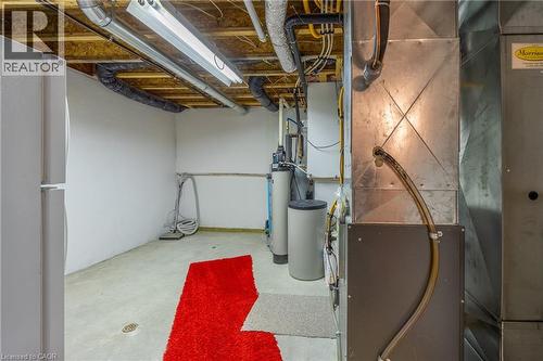 Utility room in basement. Owned gas hot water heater, owned water softener and plenty of storage. - 510 Queensway W Unit# 5, Simcoe, ON - Indoor Photo Showing Basement