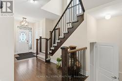 Staircase with rod iron spindles leads to upstairs - 
