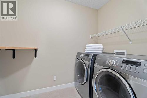 Upper floor laundry - 199 Cranarch Landing Se, Calgary, AB - Indoor Photo Showing Laundry Room