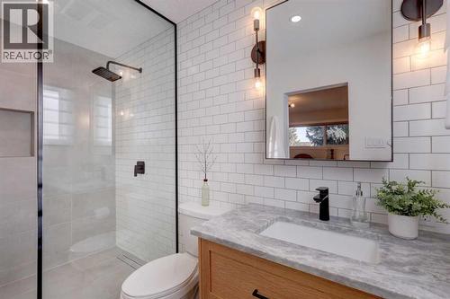 3 piece ensuite includes fully tiled shower, custom vanity and fully tiled backsplash wall - 36 Glenview Drive Sw, Calgary, AB - Indoor Photo Showing Bathroom