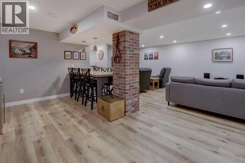 Fully finished and renovated basement includes this games area with bar and rec room - 36 Glenview Drive Sw, Calgary, AB - Indoor