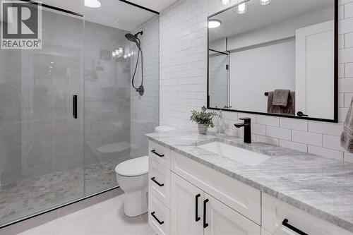 Modern basement bathroom with fully tiled walk-in shower - 36 Glenview Drive Sw, Calgary, AB - Indoor Photo Showing Bathroom