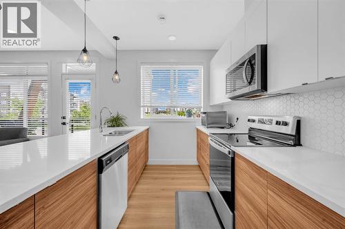 4397 Seton Drive Se, Calgary, AB - Indoor Photo Showing Kitchen With Upgraded Kitchen