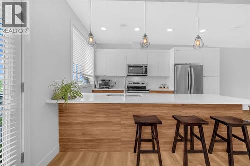 4397 Seton Drive Se, Calgary, AB - Indoor Photo Showing Kitchen With Double Sink With Upgraded Kitchen