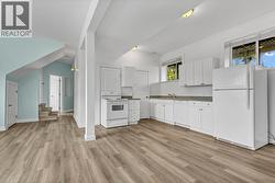 Suite - kitchen, living & dining room with elevated ceilings - 