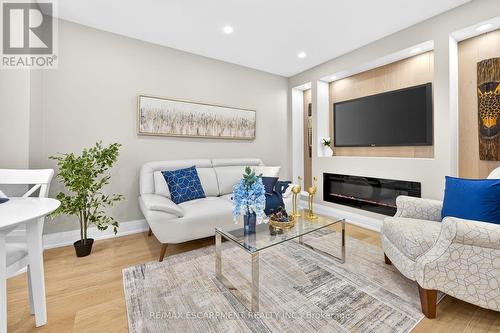150 Brucedale Avenue E, Hamilton, ON - Indoor Photo Showing Living Room With Fireplace