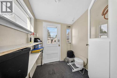Mudroom leads to backyard and garage - 414 12 Avenue Nw, Calgary, AB - Indoor Photo Showing Other Room