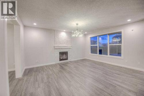 53 Sherwood Square Nw, Calgary, AB - Indoor With Fireplace