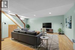 Virtually staged - Lower level family room - 