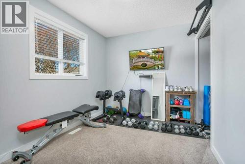 12 Rutherford Drive, Red Deer, AB - Indoor Photo Showing Gym Room