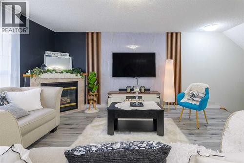 13 Mt. Aberdeen Manor Se, Calgary, AB - Indoor Photo Showing Living Room With Fireplace