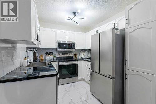 13 Mt. Aberdeen Manor Se, Calgary, AB - Indoor Photo Showing Kitchen With Stainless Steel Kitchen