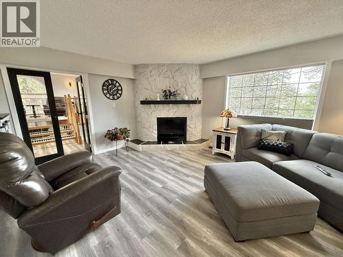 4487 Dick Road, Quesnel, BC - Indoor Photo Showing Living Room With Fireplace