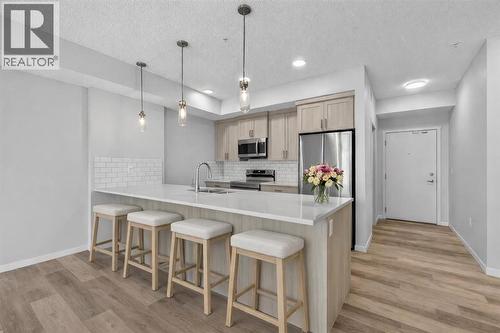 Virtual staging - 1410, 33 Carringham Gate Nw, Calgary, AB - Indoor Photo Showing Kitchen With Upgraded Kitchen