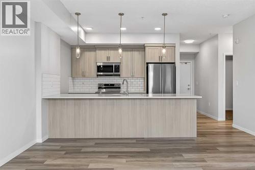 1410, 33 Carringham Gate Nw, Calgary, AB - Indoor Photo Showing Kitchen With Stainless Steel Kitchen With Upgraded Kitchen