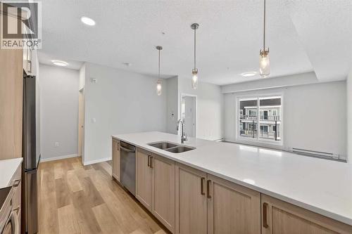 1410, 33 Carringham Gate Nw, Calgary, AB - Indoor Photo Showing Kitchen With Double Sink