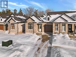 Driveway is exposed aggregate concrete. - 