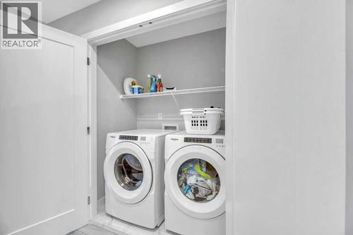Upper Laundry - 121 Dawson Circle, Chestermere, AB - Indoor Photo Showing Laundry Room