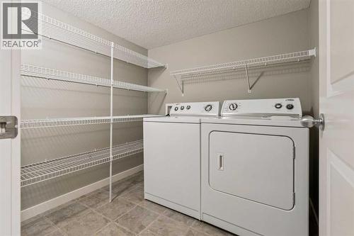327 Panamount Point Nw, Calgary, AB - Indoor Photo Showing Laundry Room