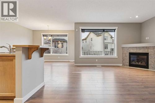 327 Panamount Point Nw, Calgary, AB - Indoor Photo Showing Living Room With Fireplace