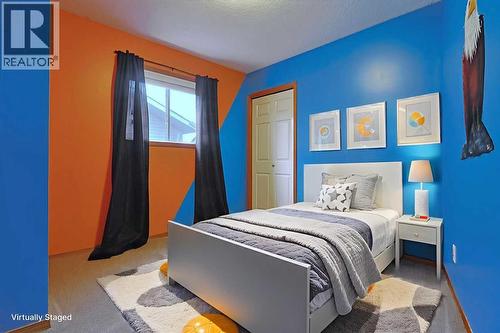 19 Sunridge Crescent Nw, Airdrie, AB - Indoor Photo Showing Bedroom