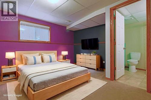 19 Sunridge Crescent Nw, Airdrie, AB - Indoor Photo Showing Bedroom