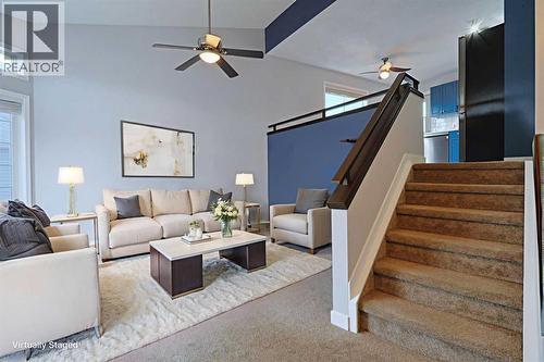 19 Sunridge Crescent Nw, Airdrie, AB - Indoor Photo Showing Living Room