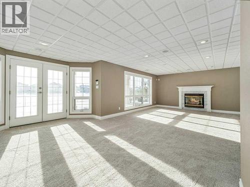 24 Fairmont Point S, Lethbridge, AB - Indoor Photo Showing Other Room With Fireplace
