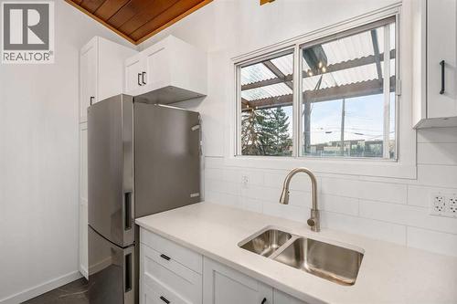 15 A Arlington Bay Se, Calgary, AB - Indoor Photo Showing Kitchen With Double Sink